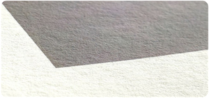 Corner of a print on Hahnemuhle Bamboo 290 gsm fine art paper, showing the paper texture