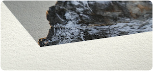Corner of a print on Hahnemuhle Hemp 290 gsm fine art paper, showing the paper texture